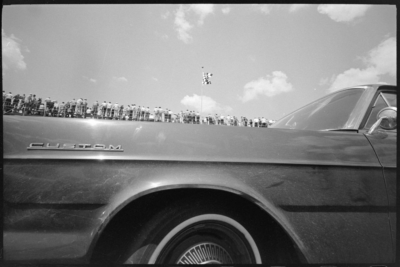 Joel Meyerowitz, Indy 500, Car With Small Figures Above, Indianapolis, Indiana, USA, 1965